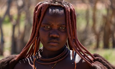 Cycling to Himba tribe in north Namibia near Opuwo on a bicycle.