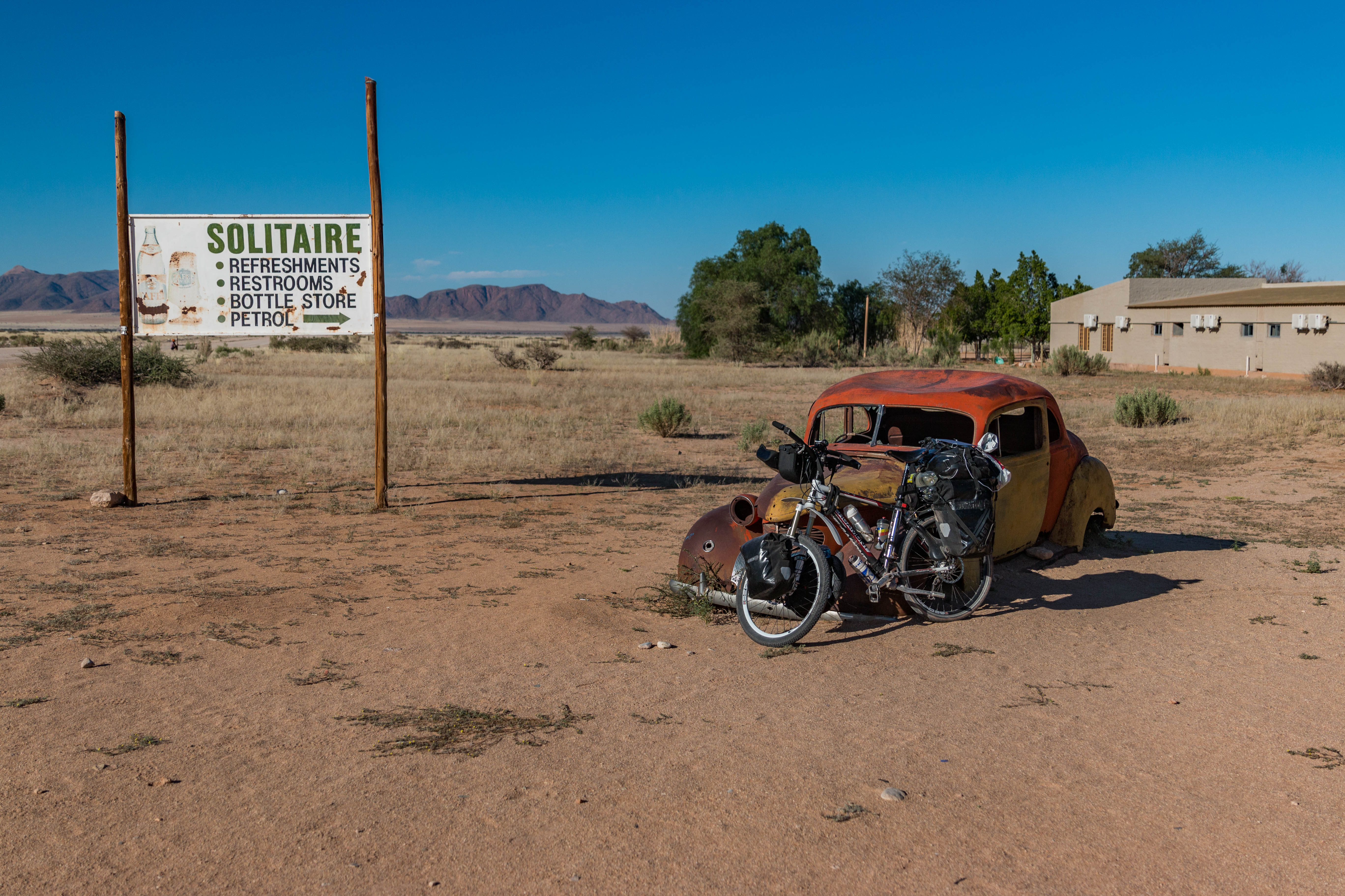 Cycling in Sersriem towards Deadvlei on C14 with a bicycle in Namibia on gravel road.