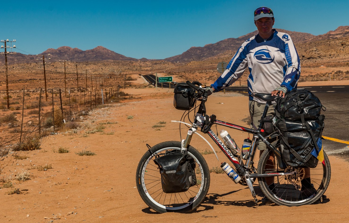 Cycle in South Africa on a bicycle on N7 road to Cape Town from Cairo.