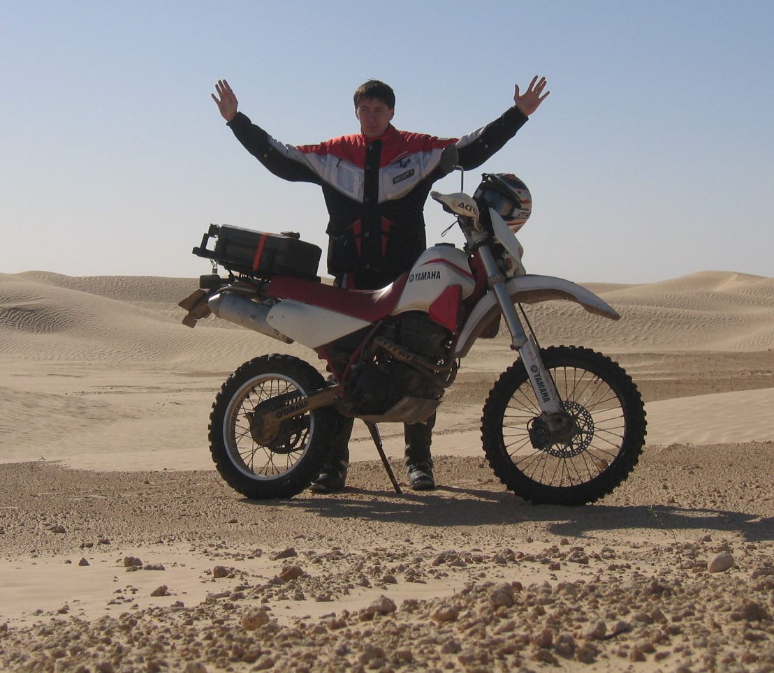 Motorcycle in Sahara in Tunisia, near Douz to Ksar Ghilane.